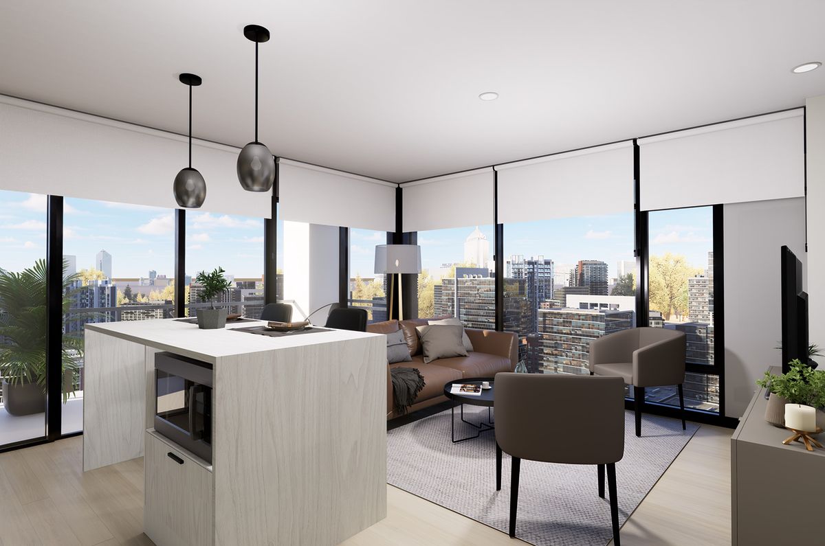 Sala y cocina con isla blanca frente a ventanales de esquina y vista a la ciudad