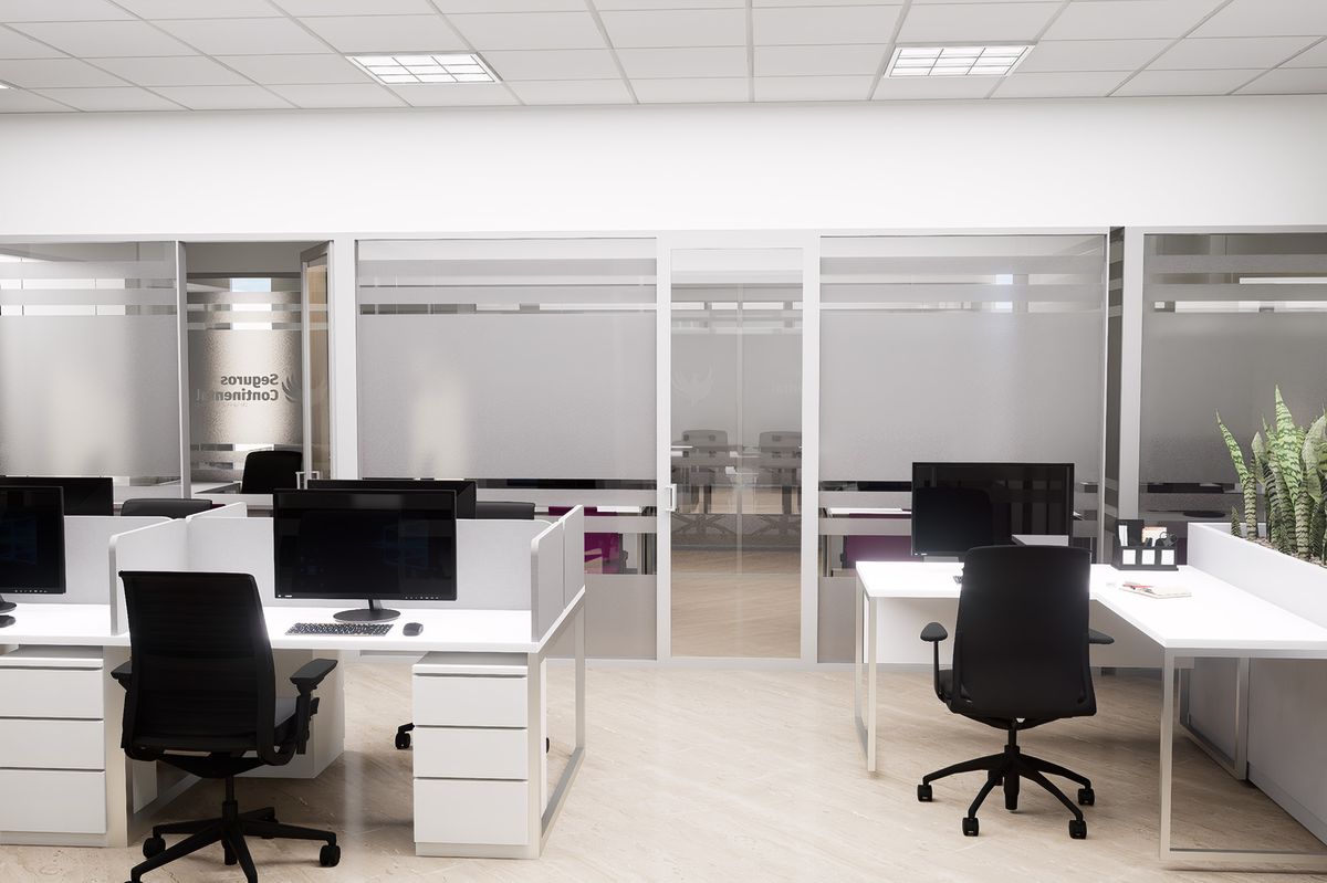 Open workstations with glass partitions and black chairs